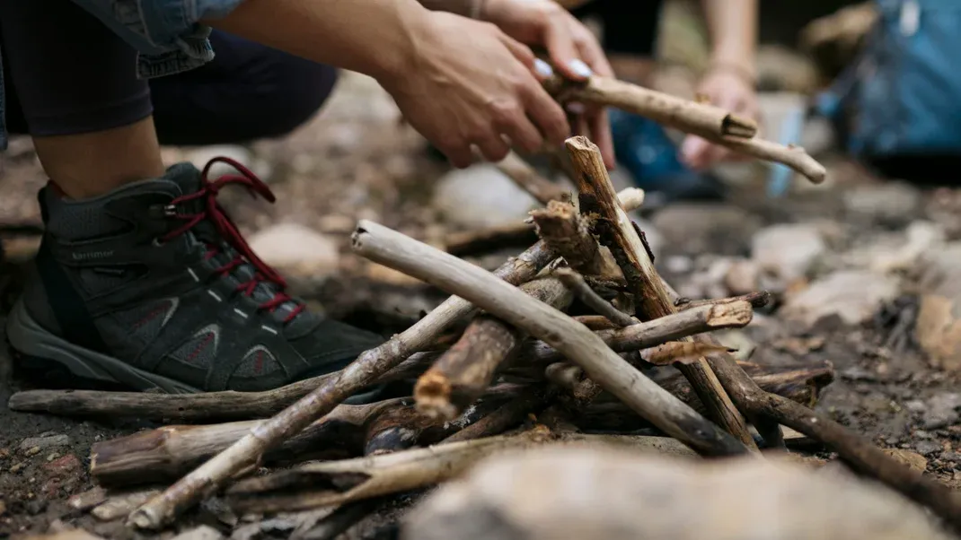 How to Make a Fire Even in the Windiest, Wettest Conditions